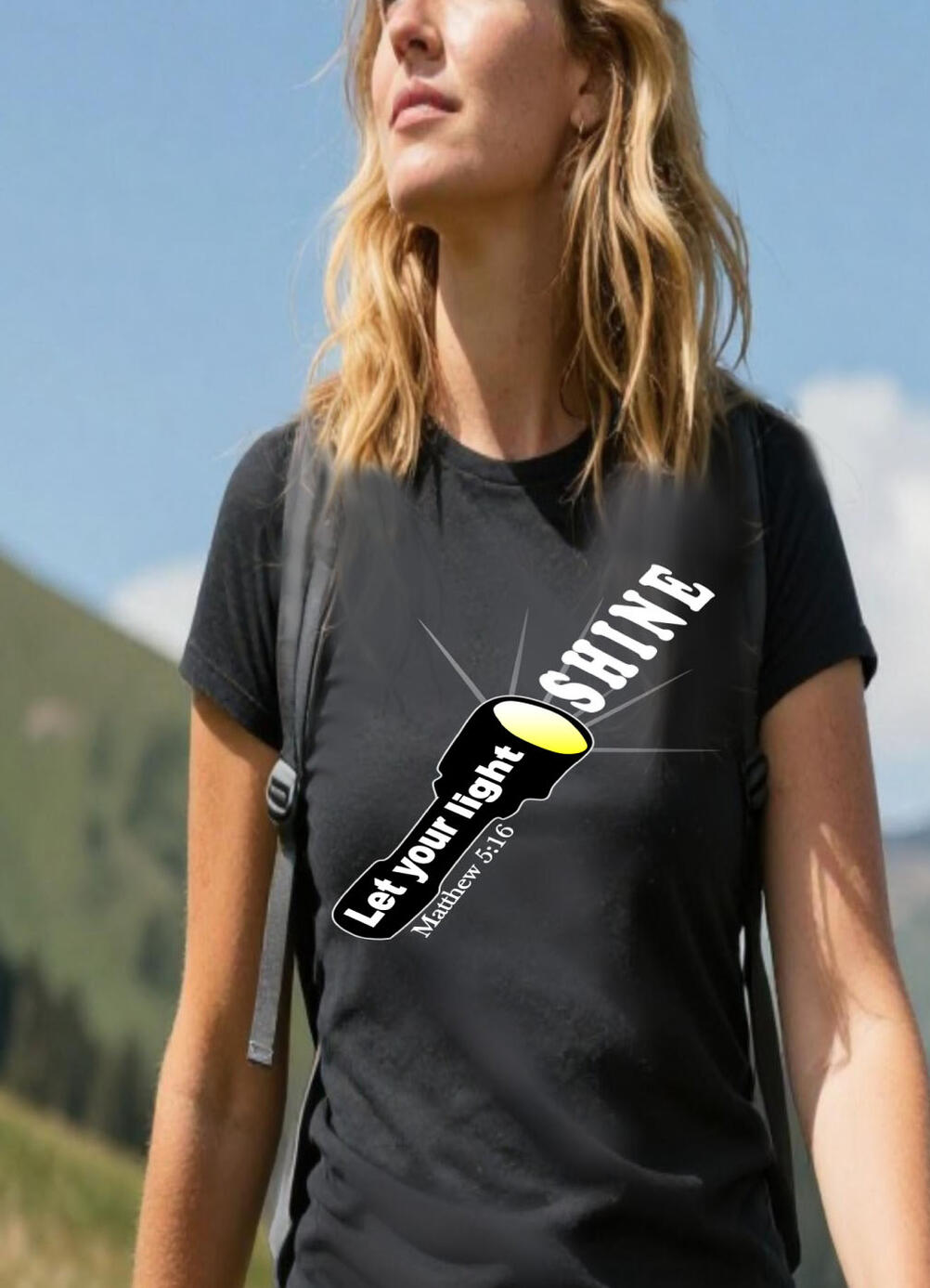 Let Your Light Shine Christian T-shirt features a flash light with the words "Let Your Light Shine.